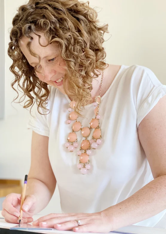 Kate drawing a technical drawing for interior design